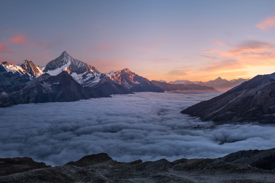 Snow-capped peaks above a sea of clouds at sunrise, an Unsplash background on a zTab new tab
